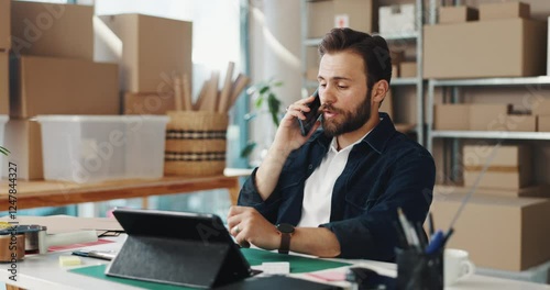 Businessman, logistics or discussion with tablet or phone call for inventory, stock or supplier issue at office. Man, distributor or talking on mobile smartphone with technology for online order
