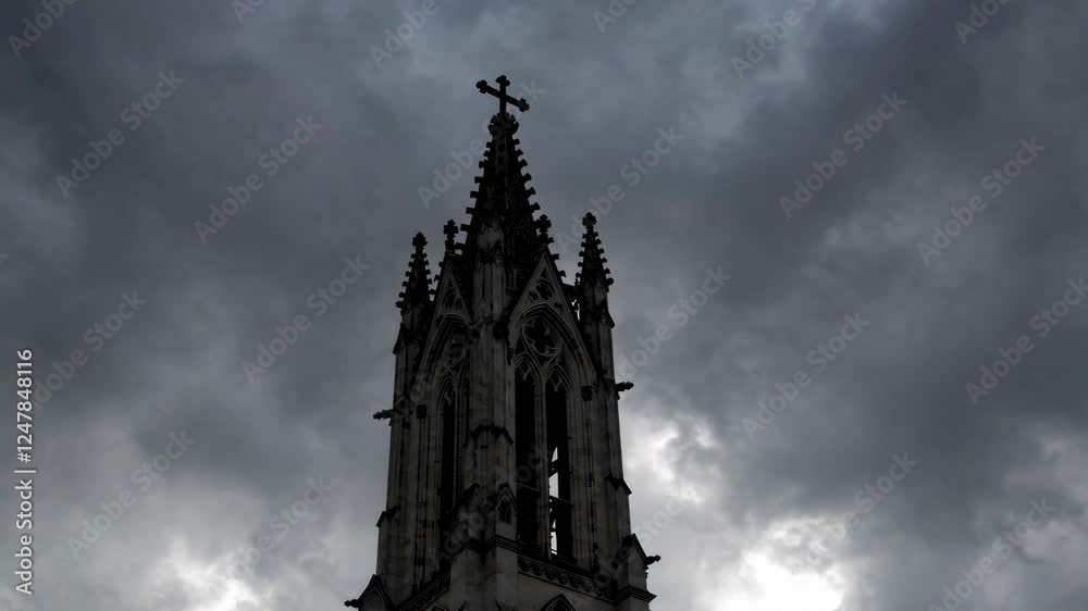 A gothic church spire rises dramatically against a backdrop of dark, heavy clouds. The mood is intensified by the approaching storm and the ominous atmosphere surrounding the structure. A gothic church spire rises dramatically against a backdrop of dark, heavy clouds. The mood is intensified by the approaching storm and the ominous atmosphere surrounding the structure.