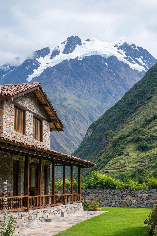 Scenic Stone House with Snow-Capped Mountain in Background Scenic Stone House with Snow-Capped Mountain in Background