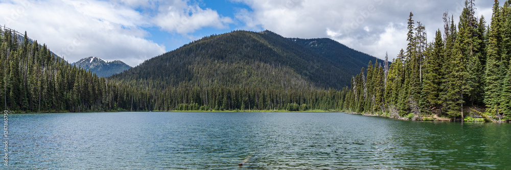 Beautiful waters of the Lightning Lake at Manning Park British Columbia Canada with clouds over the mountains Beautiful waters of the Lightning Lake at Manning Park British Columbia Canada with clouds over the mountains