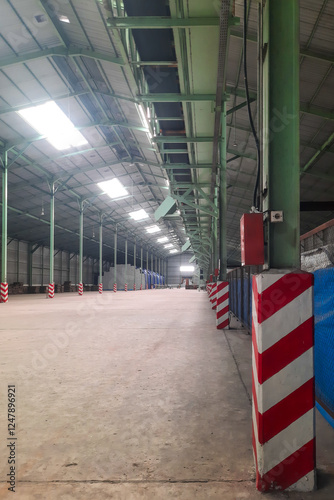 Bilde på lerret Interior view of a massive empty industrial warehouse featuring green steel pill