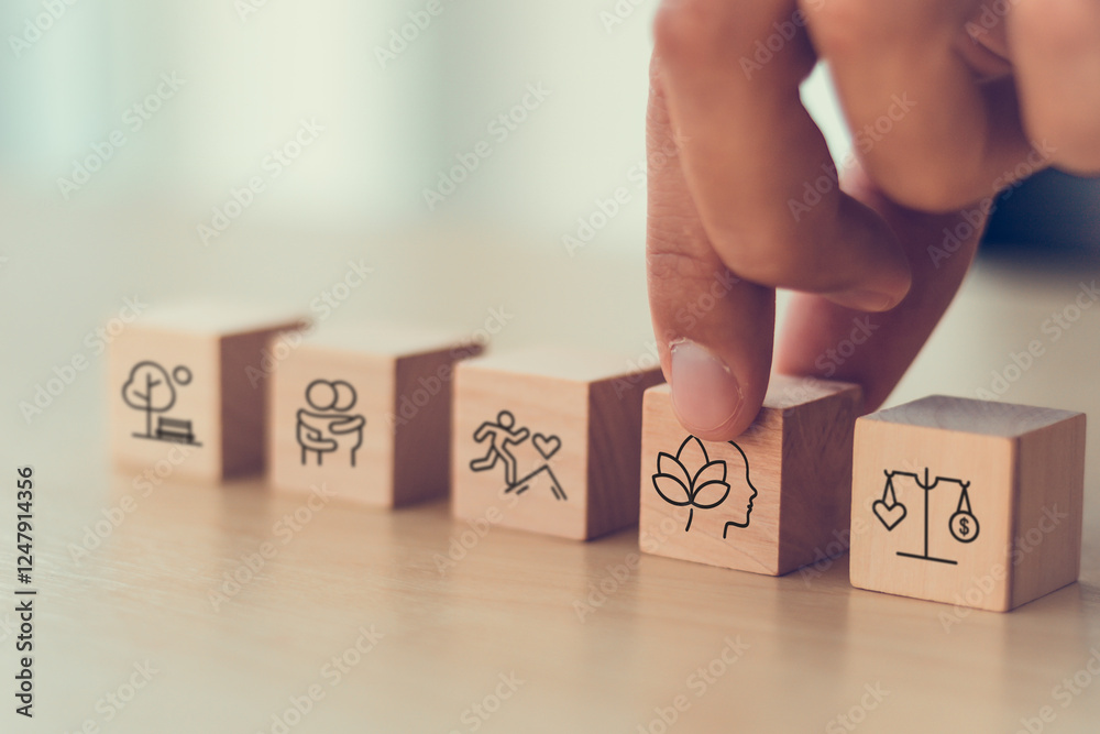 Naklejka premium Holistic Wellness Concept. Wooden block with wellness icons, health care ,including mental well-being, fitness, nutrition, sleep, relationships and financial balance. Personal development and balance.
