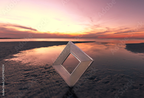 Surreal landscape with a metal triangle on the ocean