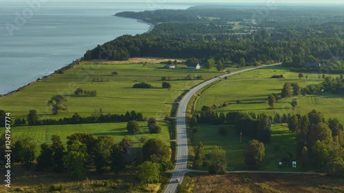 Wallpaper Mural Aerial View Of Road Along The Green Fields In Summer In Kurzeme, Latvia. Torontodigital.ca