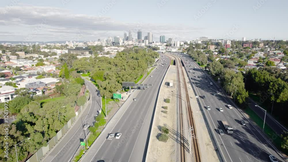 Cars Driving on Highway 2 Along The Yanchep Line In Suburban Perth City, Western Australia. - aerial shot Cars Driving on Highway 2 Along The Yanchep Line In Suburban Perth City, Western Australia. - aerial shot