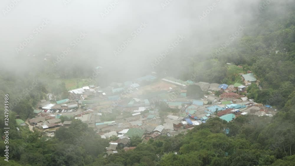 aerial view from doi pui view point to the local village among the mountain range hill valley with white cloud and fog over the village in winter daytime aerial view from doi pui view point to the local village among the mountain range hill valley with white cloud and fog over the village in winter daytime