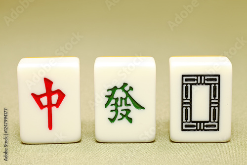 Chinese mahjong tiles, close-up of mahjong tiles on green background  