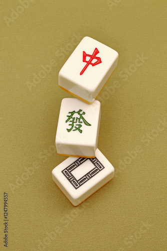 Chinese mahjong tiles, close-up of mahjong tiles on green background  