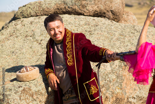 Kazakh woman and man in national costumes photo
