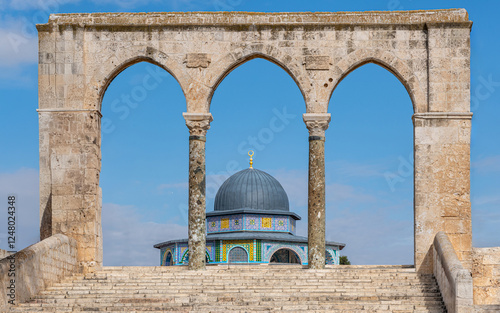 Dome of the Chain at the Temple Mount in Jerusalem, framed by columns of an ancient archway