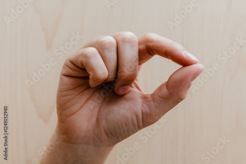 Human hand sign for small photo