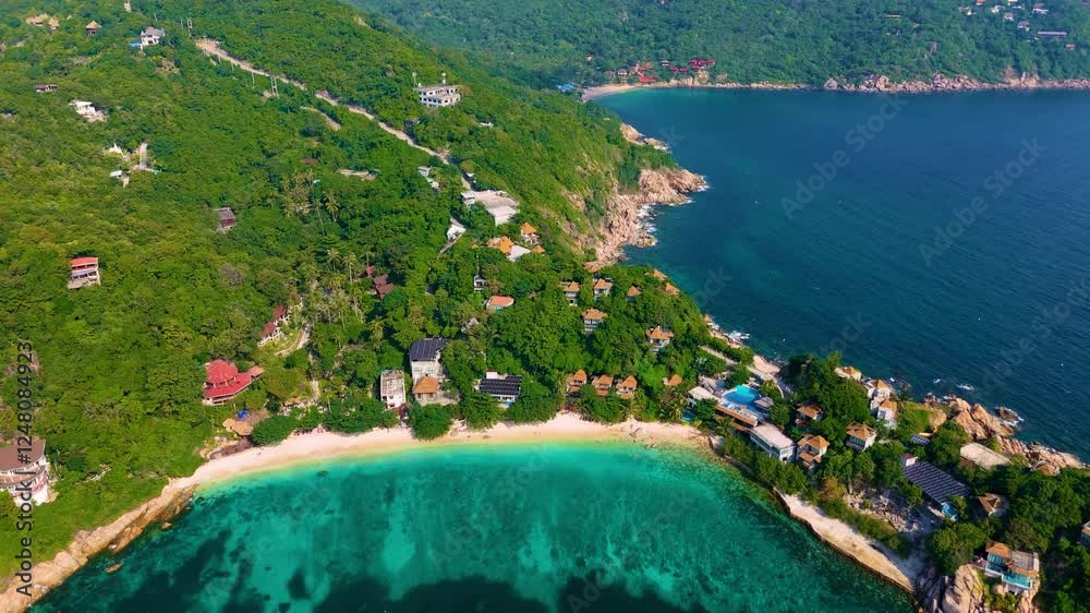 Aerial drone view of Koh Tao island, Thailand. Pristine white sand beach and clear turquoise water.