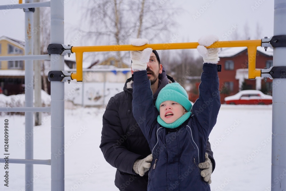 Obraz premium A father and son enjoy a fun winter activity outdoors, tubing down a snowy hill. The photo captures their joyful smiles, bonding moments, and the excitement of a thrilling winter sport