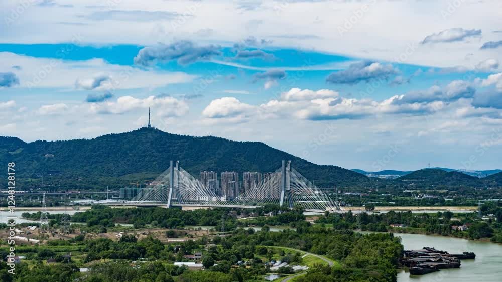 Exploring picturesque mountains and bridges under a bright blue sky with rolling white clouds in a serene time lapse