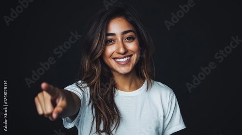 Smiling woman in white tshirt against minimal black background