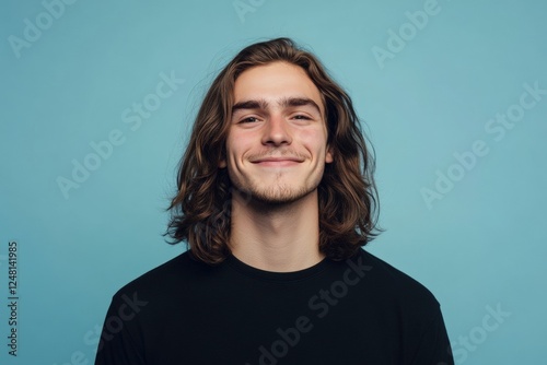 Smiling Young Man with Long Wavy Hair, Casual Studio Portrait. Generative AI.