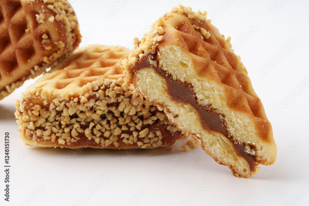Delicious crispy wafers filled with creamy caramel and coated in crunchy nuts Delicious crispy wafers filled with creamy caramel and coated in crunchy nuts