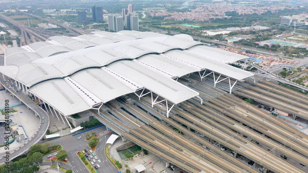 Aerial view of Guangzhou South Railway Station showcasing high speed rail traffic and surrounding urban landscape