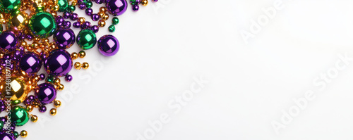 Designer frame with beads or garland in purple, green and yellow, traditional colors of Mardi Gras carnival, Decorative glossy realistic elements isolated on white background