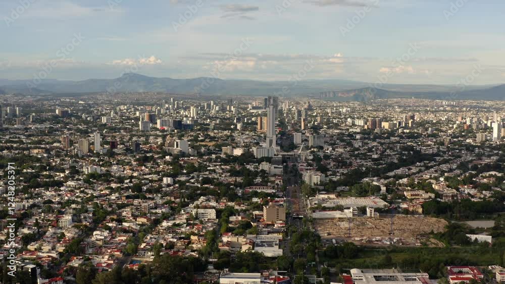 DRONE: DOLLY ZOOM SHOT OF GUADALAJARA CITYSCAPE AT SUNSET DRONE: DOLLY ZOOM SHOT OF GUADALAJARA CITYSCAPE AT SUNSET