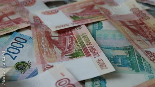 The currency of Russia. Close-up of Russian rubles. Financial concept. The background and texture of banknotes. Banknotes in denominations of 5000, 2000 and 1000 rubles. View from above