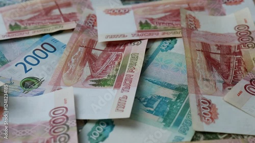 The currency of Russia. Close-up of Russian rubles. Financial concept. The background and texture of banknotes. Banknotes in denominations of 5000, 2000 and 1000 rubles. View from above