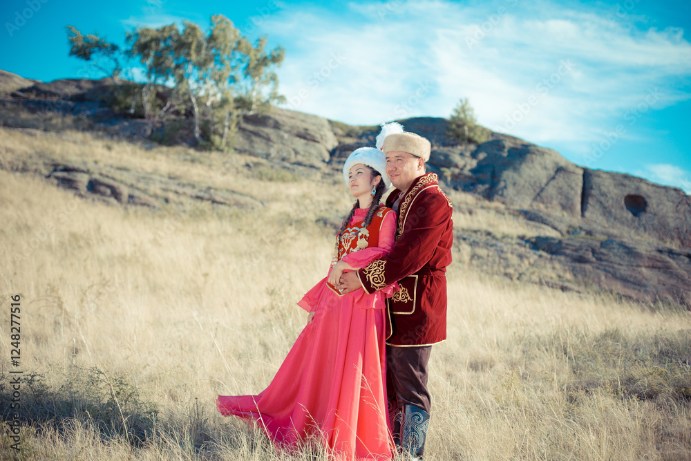 Fototapeta premium Kazakh woman and man in national costumes