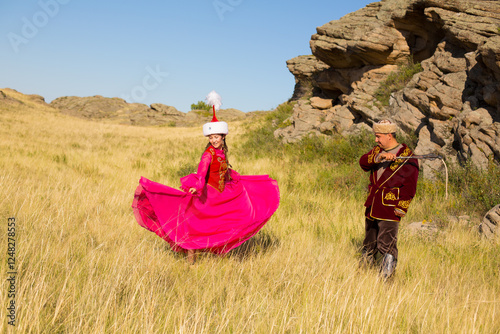 Kazakh woman and man in national costumes