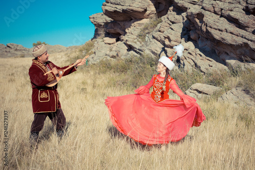 Kazakh woman and man in national costumes photo