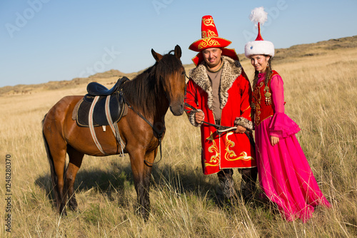 Kazakh woman and man in national costumes photo