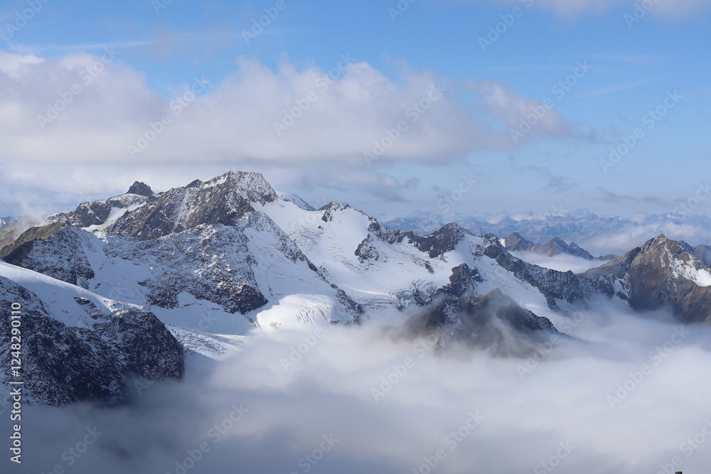 Majestic Snow-Capped Alpine Peaks Above the Clouds Majestic Snow-Capped Alpine Peaks Above the Clouds