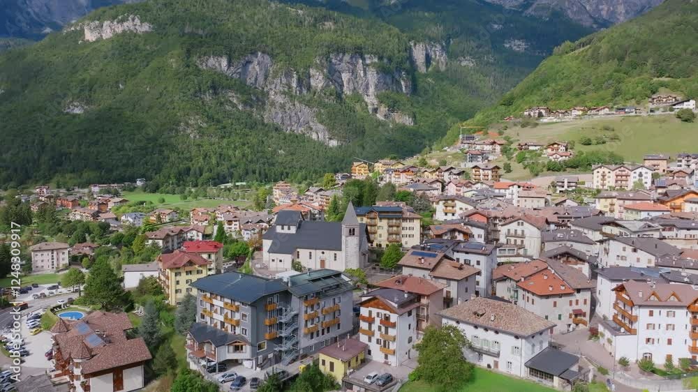 Aerial video moving away from the town of Molveno in northern Italy with the Dolomite mountains in the background. Aerial video moving away from the town of Molveno in northern Italy with the Dolomite mountains in the background.
