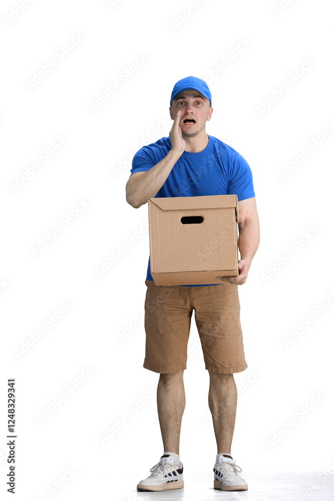 A male deliveryman, on a white background, full-length, with a box, tells a secret A male deliveryman, on a white background, full-length, with a box, tells a secret