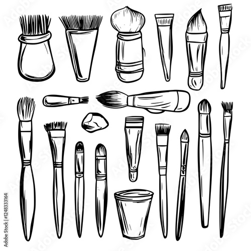 Diverse assortment of painting brushes and tools used for artistic expression and creativity in a studio environment