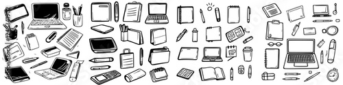 Workspace essentials featuring various office supplies, electronic devices, and stationery items scattered across a desk