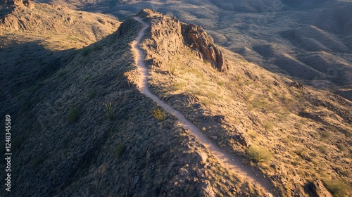 Stunning mountain range at sunset, rugged peaks casting long shadows, ideal for adventure and nature exploration themes.