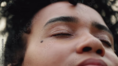 Young woman opening eyes to SKY feeling HOPE and FAITH, overcoming obstacles of meditative contemplative 20s female person