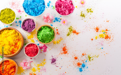 Happy Holi decoration, the indian festival.Top view of colorful holi powder on white background. photo