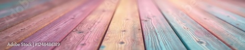 Batiste material in pastel shades scattered on a wooden floor, soft focus, wood