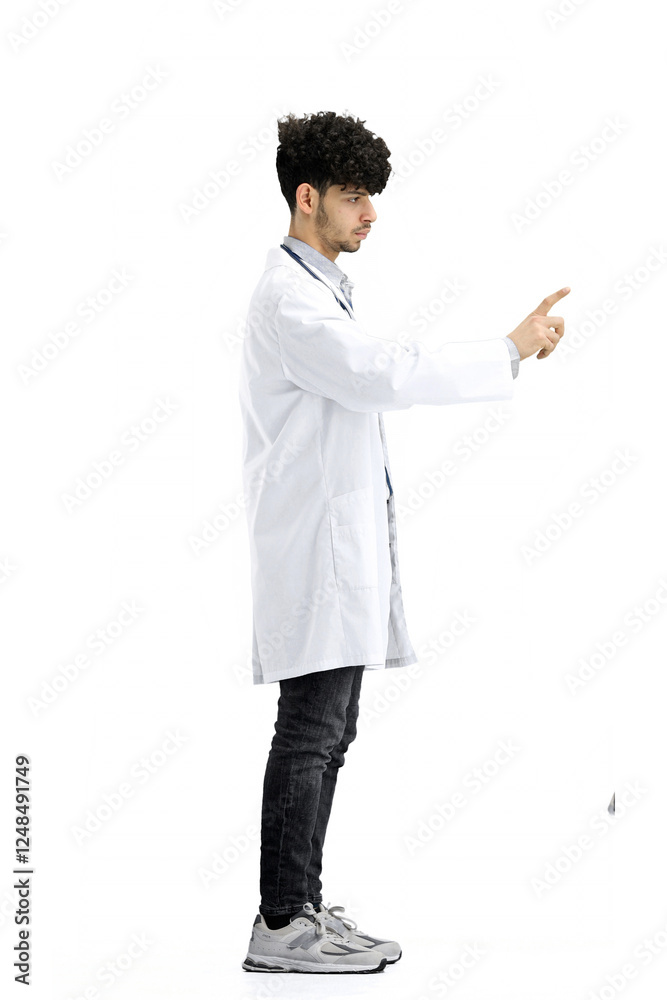 Male doctor, full-length, on a white background, shows a stop sign Male doctor, full-length, on a white background, shows a stop sign