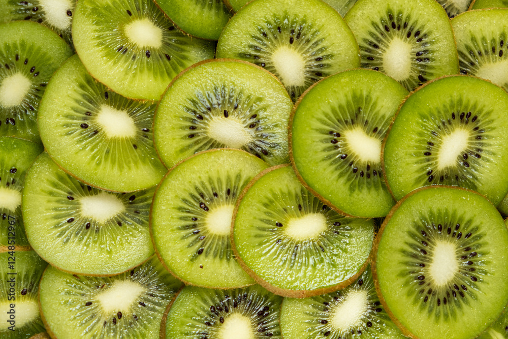 Vibrant Background of Freshly Sliced Kiwi Fruit Rings. A Lush and Refreshing Tropical Fruit Pattern with Juicy Green Tones Vibrant Background of Freshly Sliced Kiwi Fruit Rings. A Lush and Refreshing Tropical Fruit Pattern with Juicy Green Tones