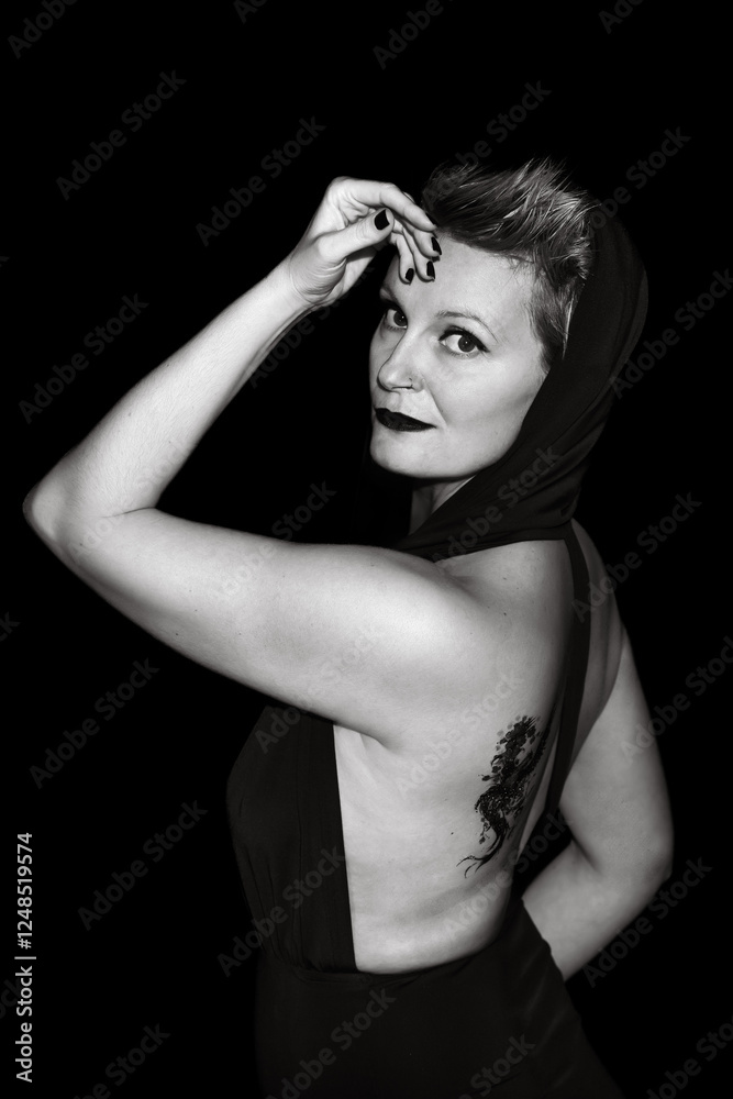 A beautiful woman with short blonde hair and a mask over her eyes.