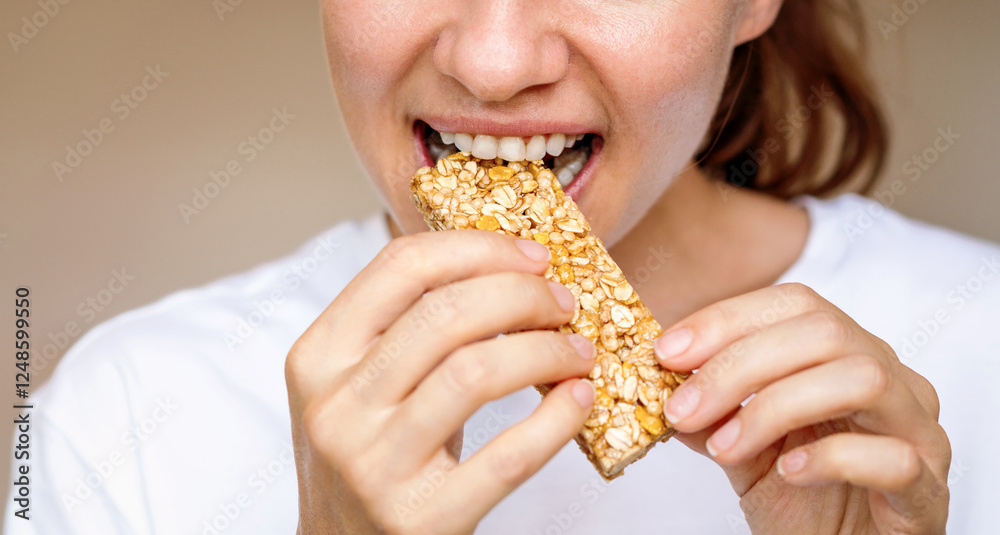 Woman eating protein bar. Healthy diet. Woman eating protein bar. Healthy diet.