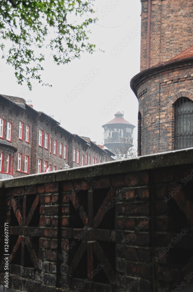 Fototapeta premium Decorative brick wall of the old town next to a neighborhood