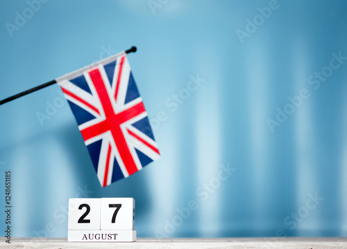 Calendar August With British Flag With Number 27. Calendar cubes with numbers. Space copy. photo