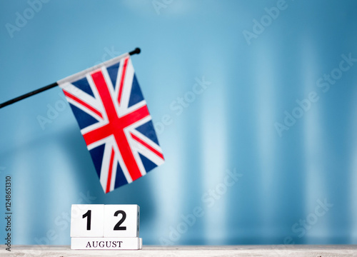 Calendar August With British Flag With Number 12. Calendar cubes with numbers. Space copy. photo