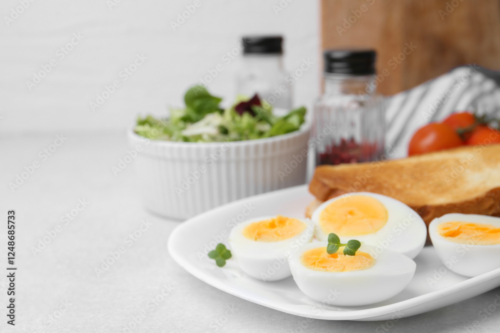 Hard boiled eggs with bread on light table, closeup. Space for text Hard boiled eggs with bread on light table, closeup. Space for text