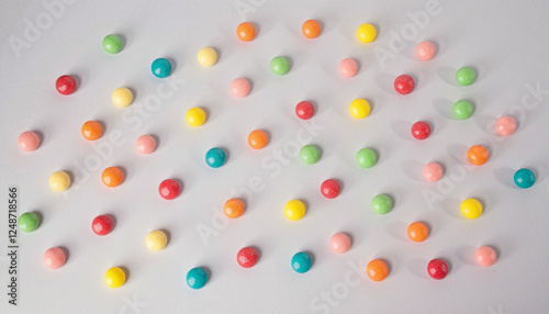 Colorful arrangement of sugar-free candies on grey background, healthy treats