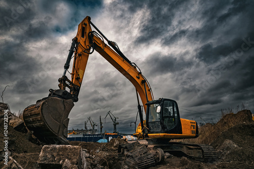 Excavator and cranes in the Gdansk Stocznia, old shipyard