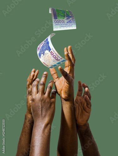 Many black African hands reaching out for West Africa CFA francs notes money over green background. Stretching arms for cash